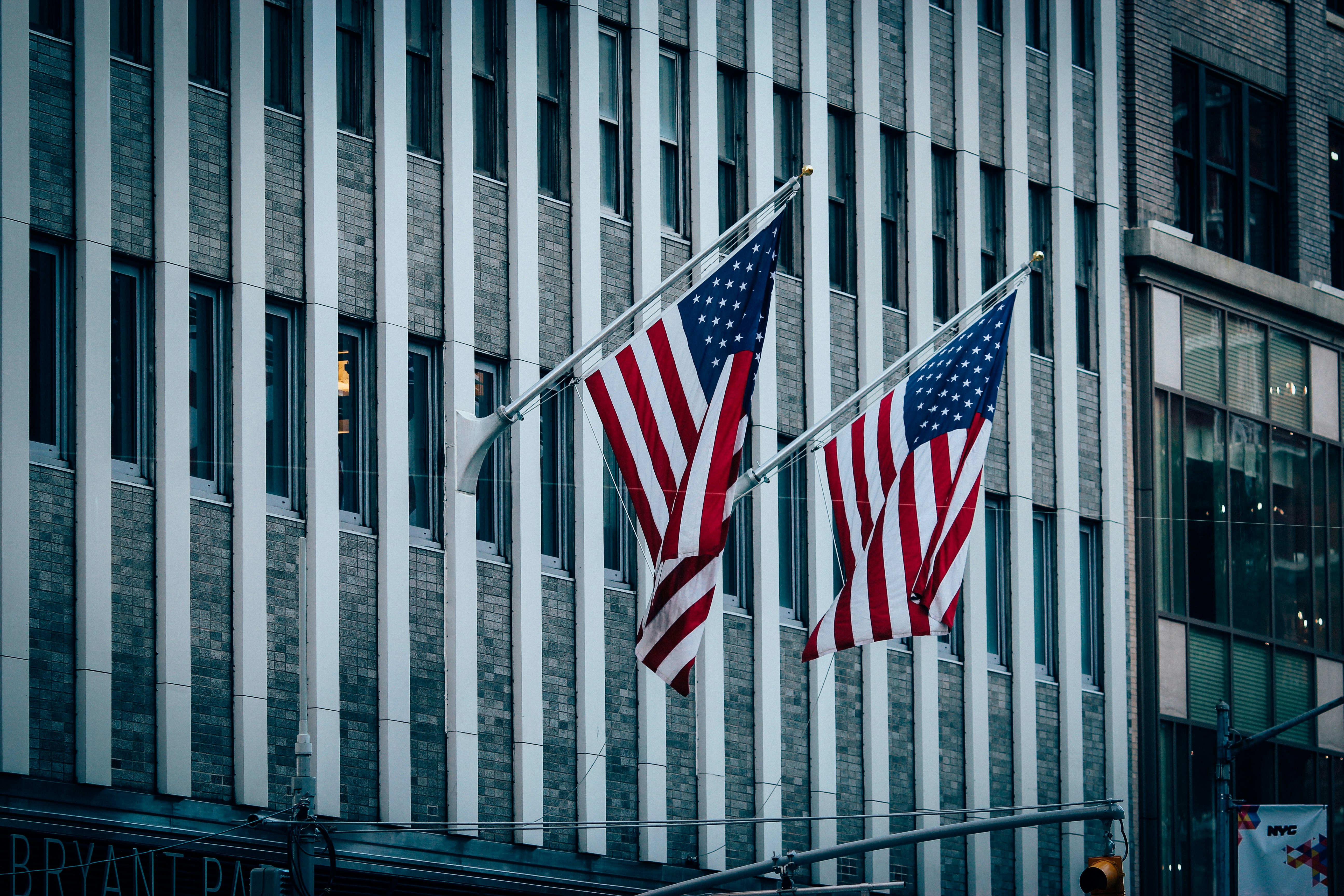 us a flag on white metal fence